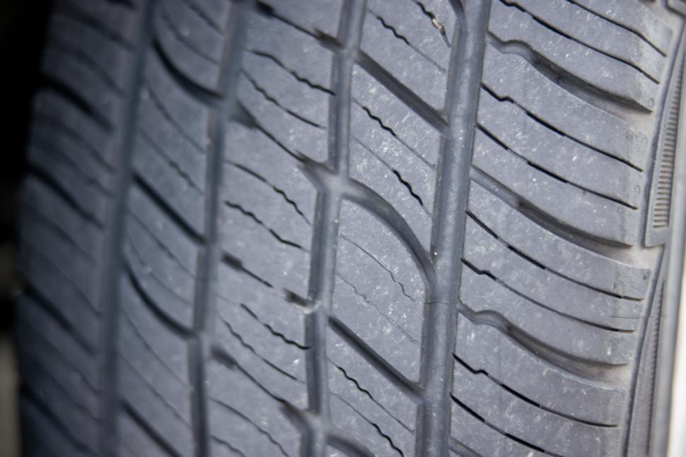 Free Image of Close-up of car tire tread pattern 