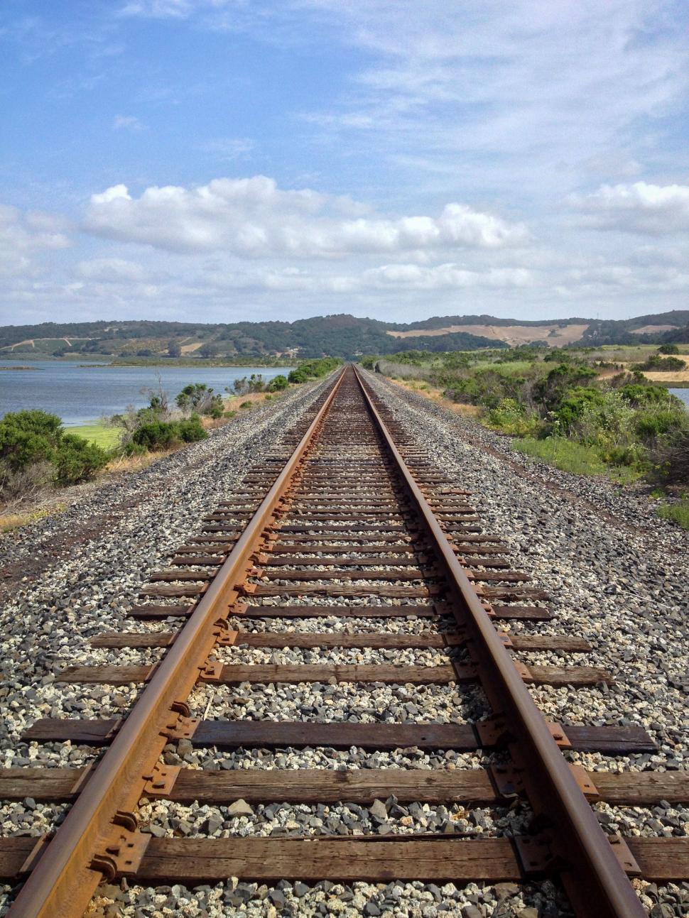 Free Image of Straight railroad tracks leading to the horizon 
