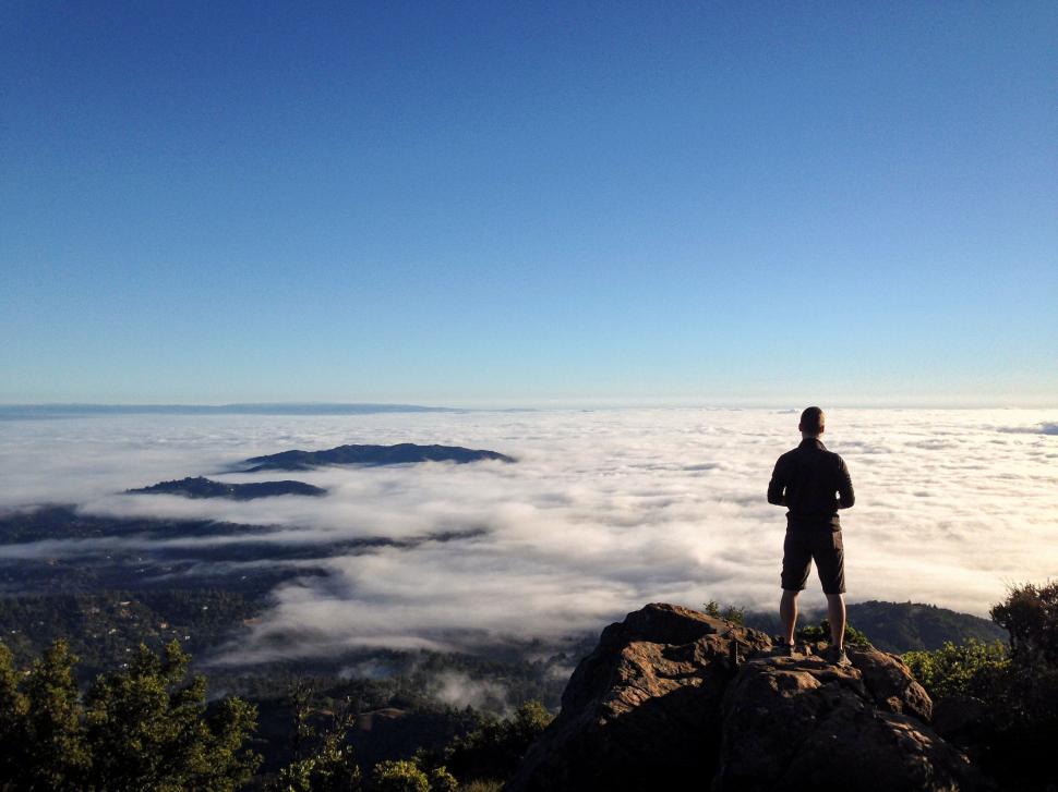 Free Image of Man overlooking a sea of clouds 