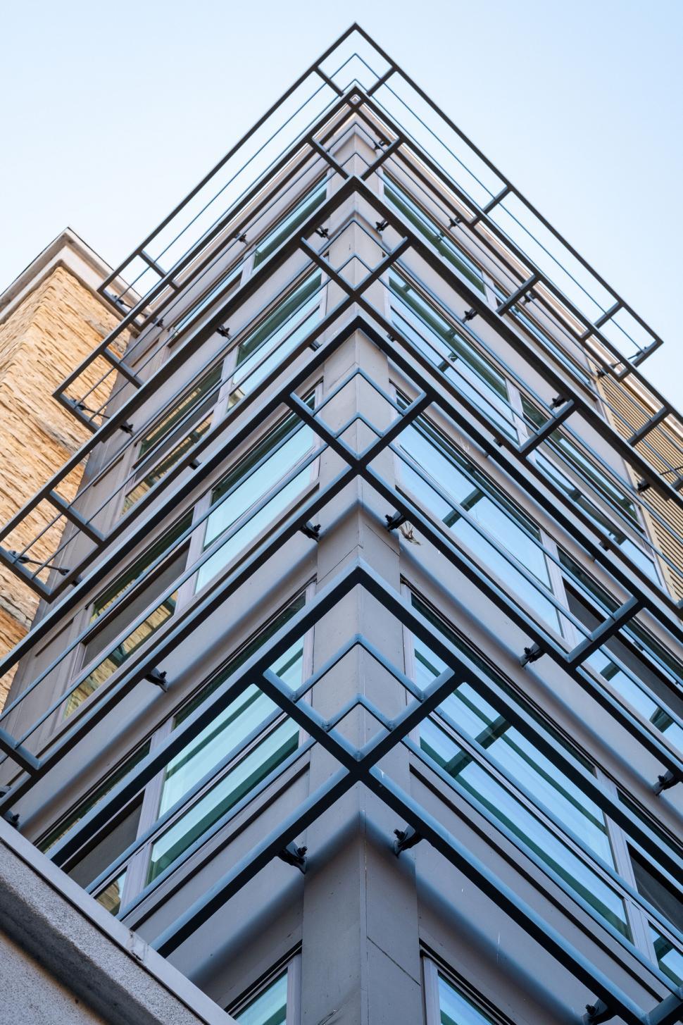 Free Image of Modern glass commercial building with geometric facade 