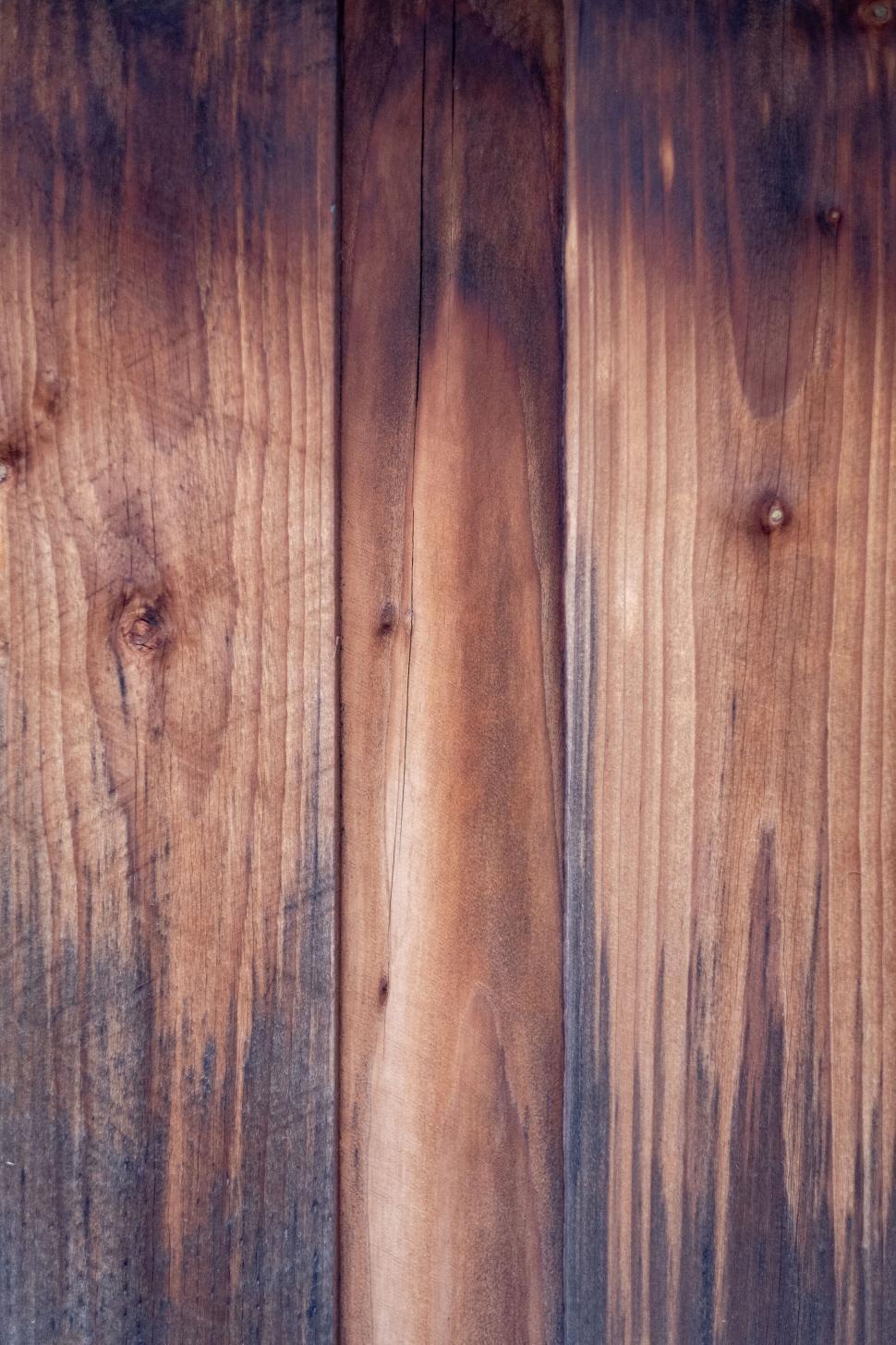 Free Image of Wooden boards with unique grain patterns texture 