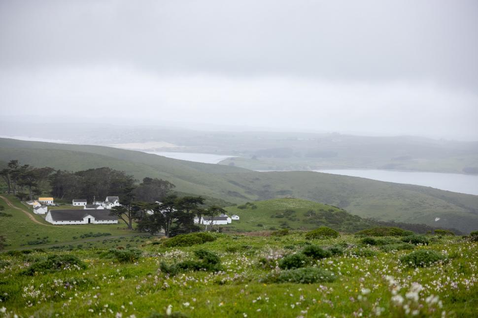 Free Image of Foggy coastal view with white houses 