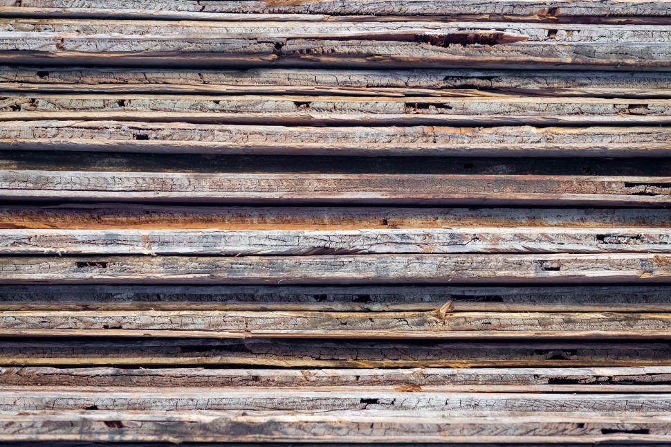 Free Image of Textured stacked wooden logs background 