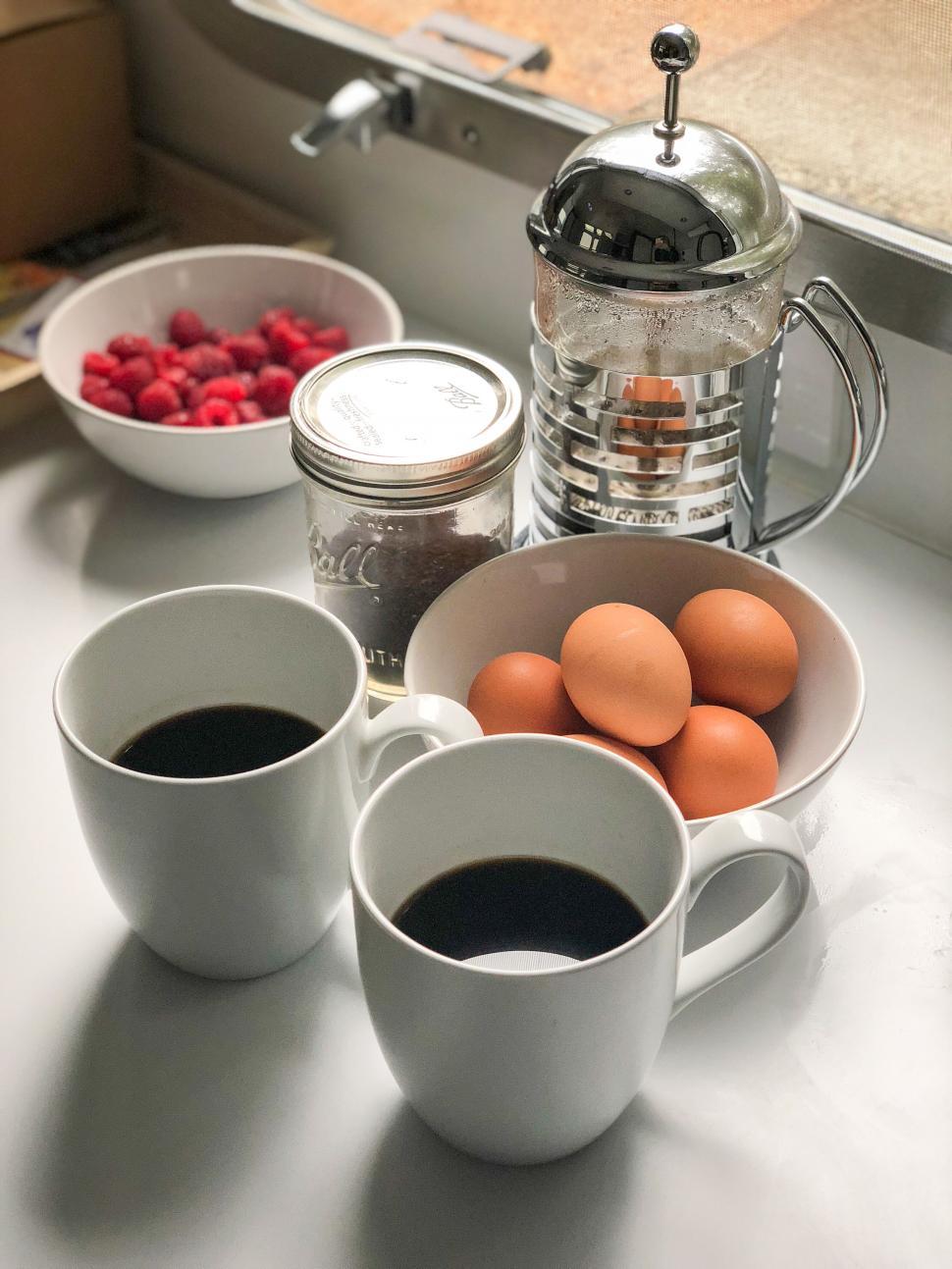 Free Image of Cozy breakfast set up with eggs and coffee 
