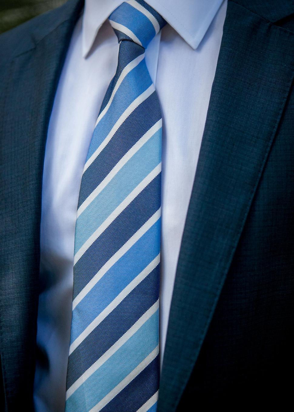 Free Image of Close-up of a tie on a business suit 