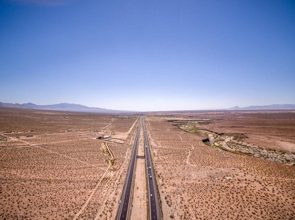 Free Image of Desert road extending towards mountains 