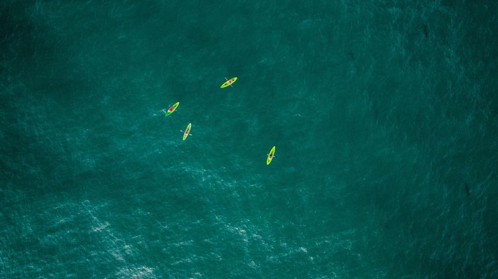 Free Image of Kayakers in emerald ocean water 