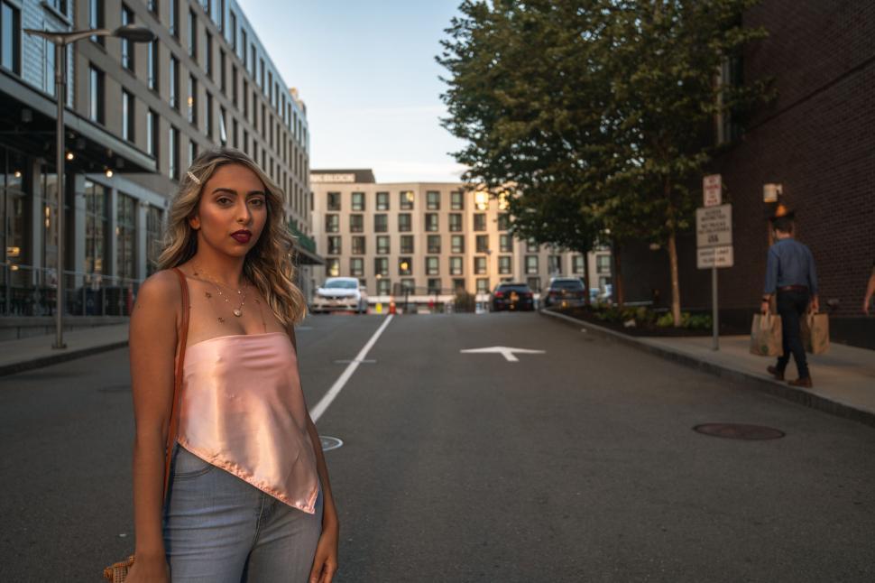 Free Image of Woman in city street at golden hour 