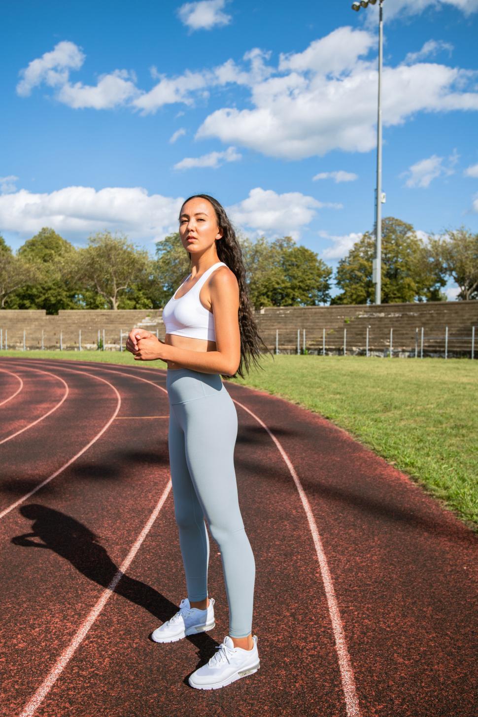 Free Image of Athletic woman at the starting line on a track 