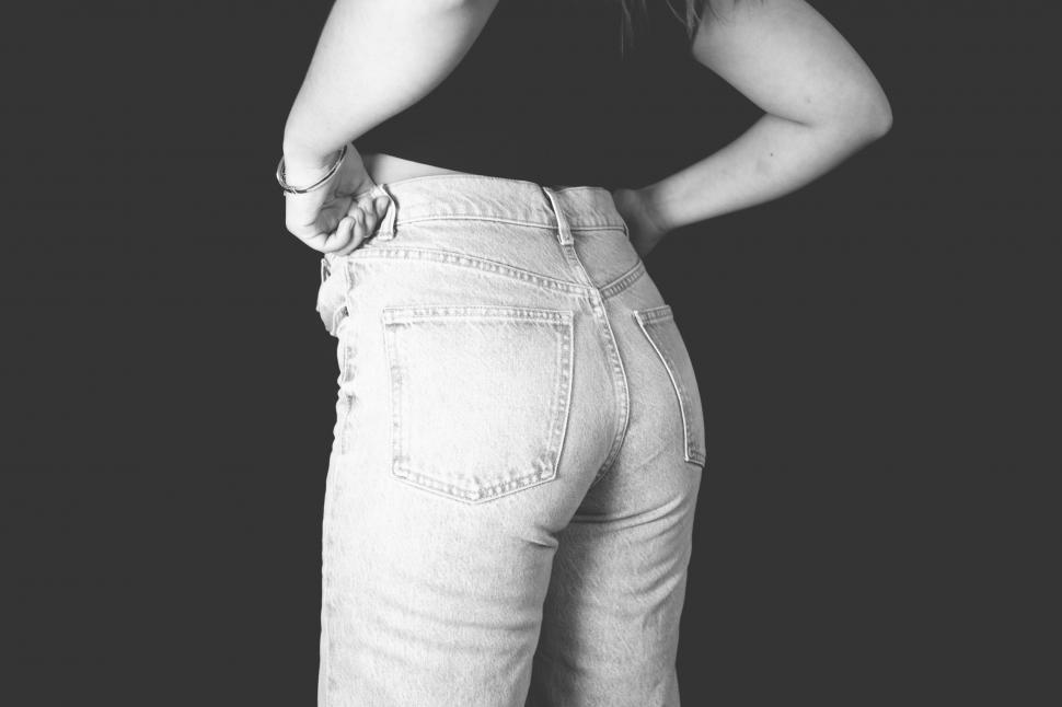 Free Image of Black and white image of woman s back jeans 