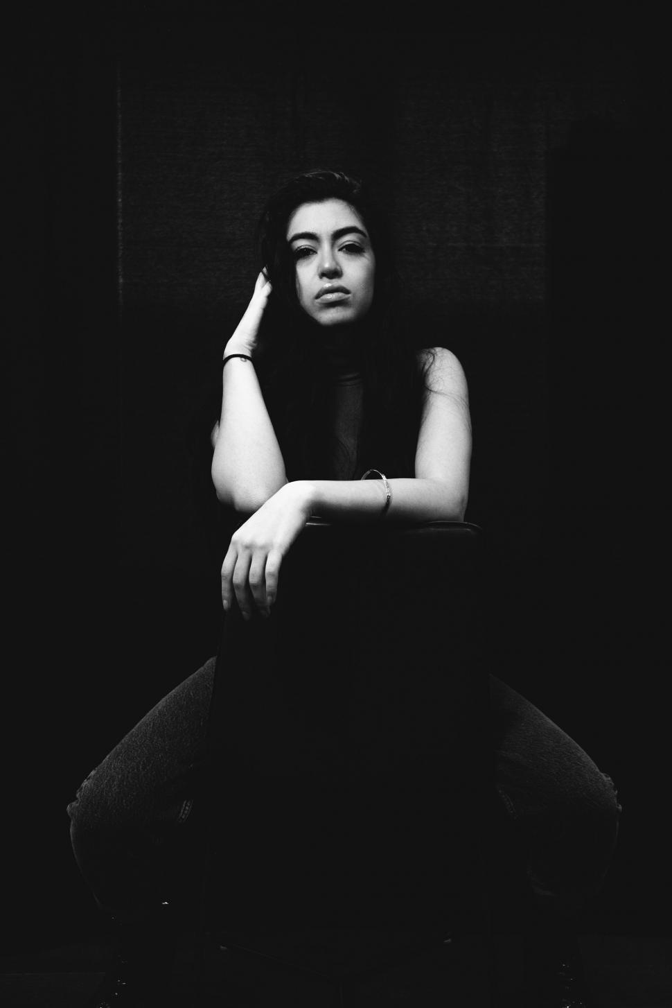 Free Image of Monochrome image of woman in introspective pose 