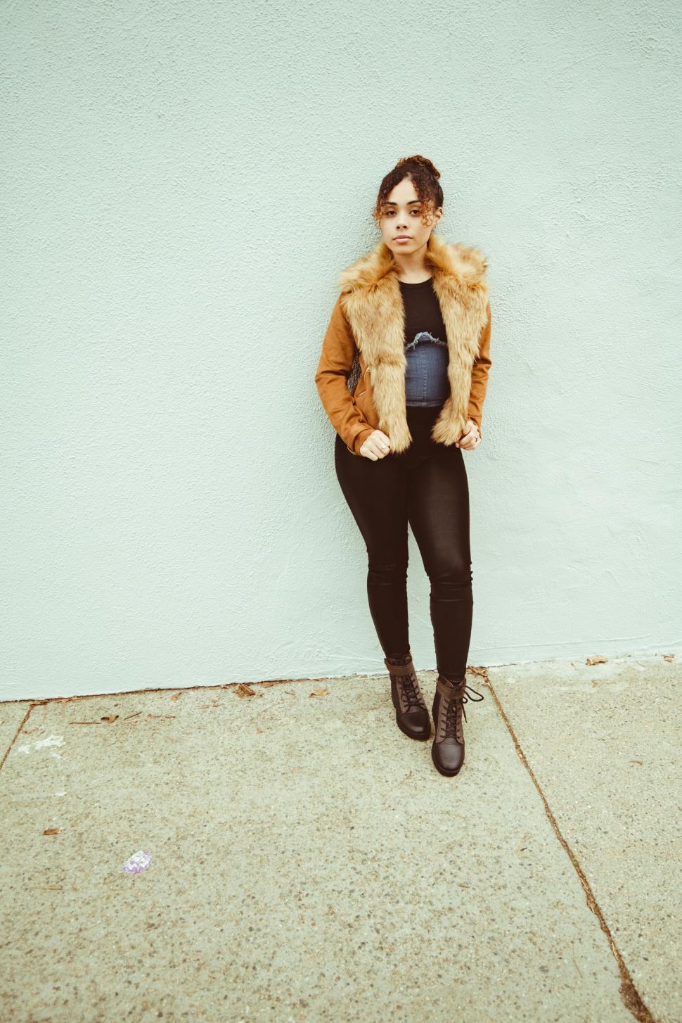 Free Image of Fashionable woman against wall 