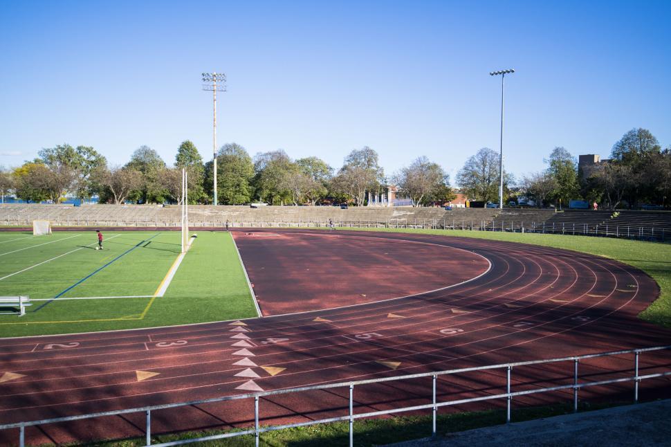 Free Image of Empty running track on a clear sunny day 