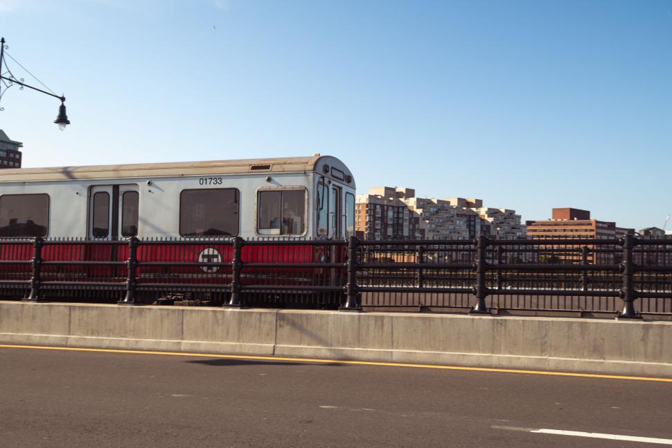 Free Image of Red and white train on urban railway 