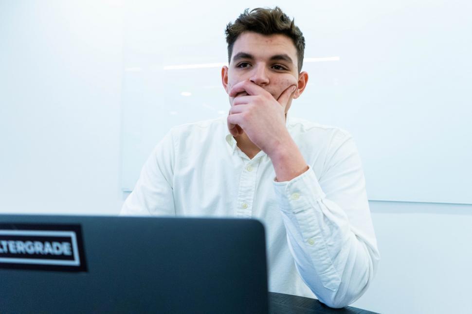 Free Image of Focused man working on laptop in office 