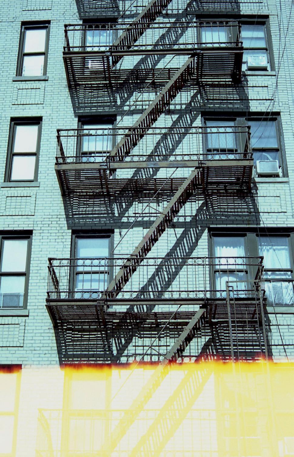 Free Image of Fire escape on a vintage brick building 