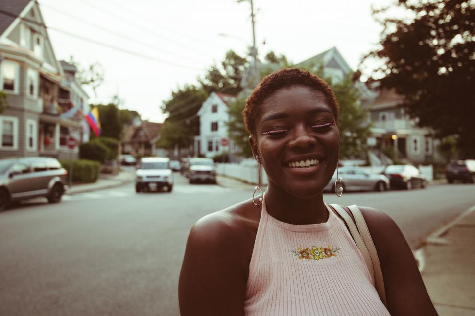 Free Image of Smiling woman on residential street 