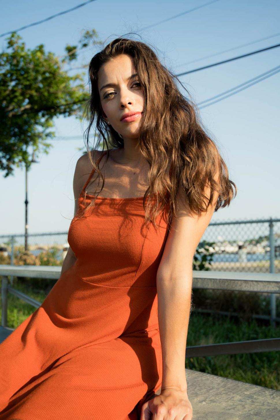 Free Image of Fashion Model in Orange Dress Outdoors 