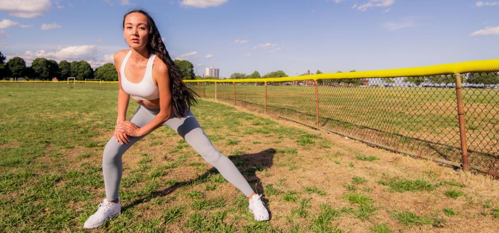 Free Image of Active Woman Stretching on Field 
