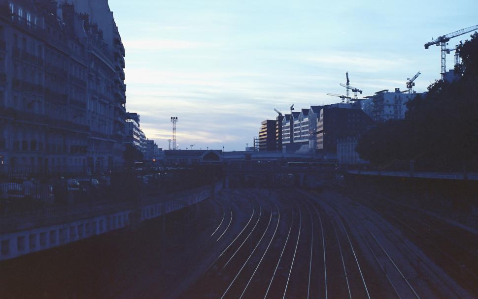 Free Image of Dusk view of cityscape with train tracks 
