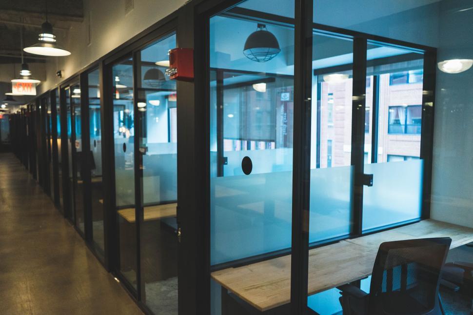 Free Image of Modern office corridor with glass partitions 