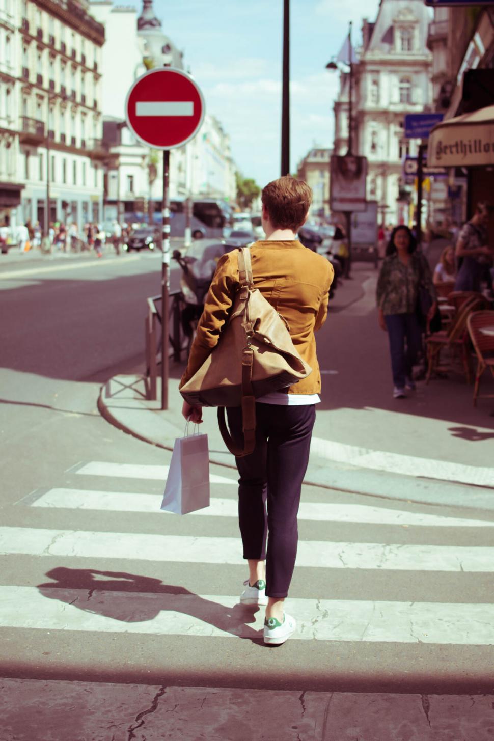 Free Image of Person crossing street in stylish attire 