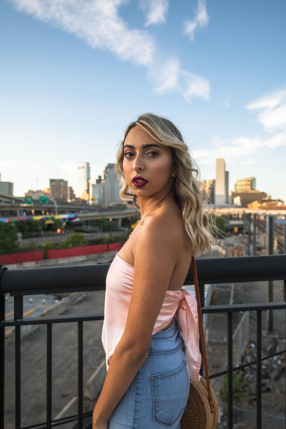 Free Image of Woman with skyline in the background 