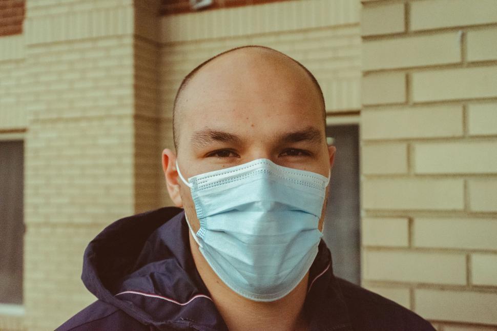 Free Image of Man in a blue medical face mask 