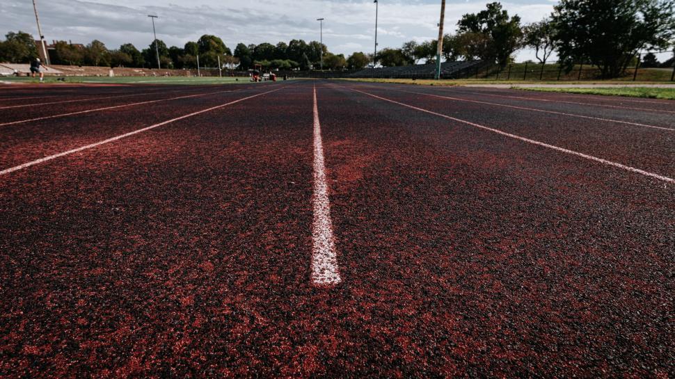 Free Image of Empty running track with white line 