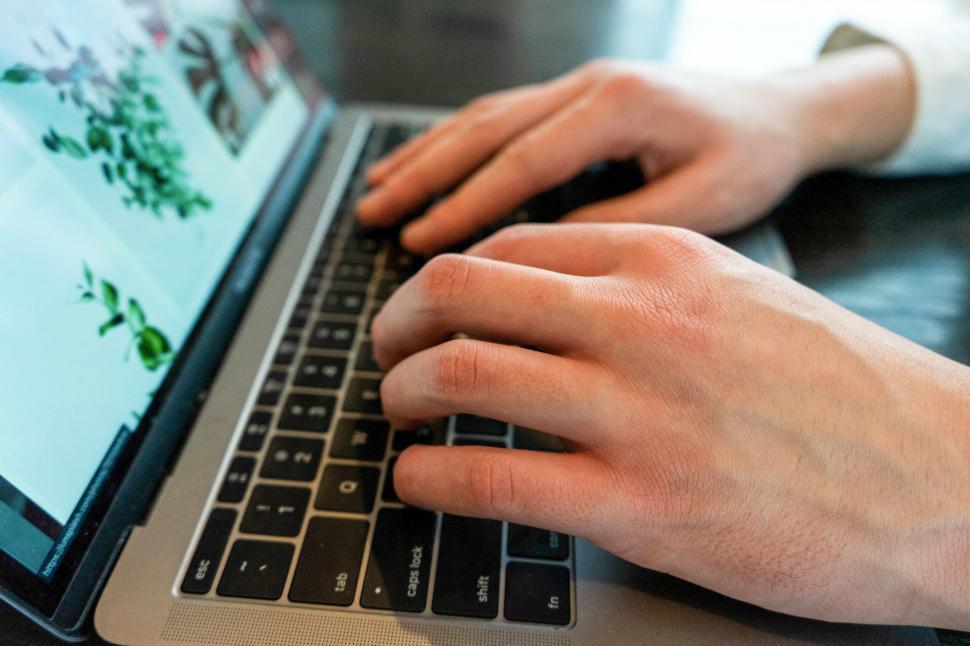 Free Image of Hands typing on a modern laptop keyboard 