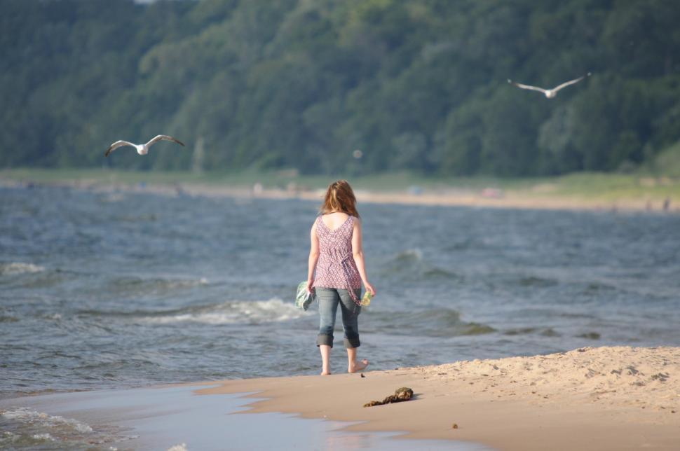 Free Image of Girl walks along the Beach 