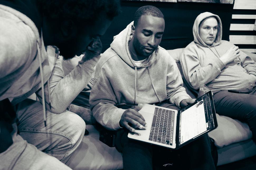 Free Image of Group of friends working on a laptop 