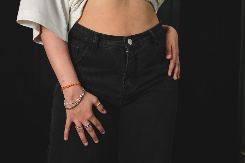 Free Image of Close-up of woman s midsection and hands 