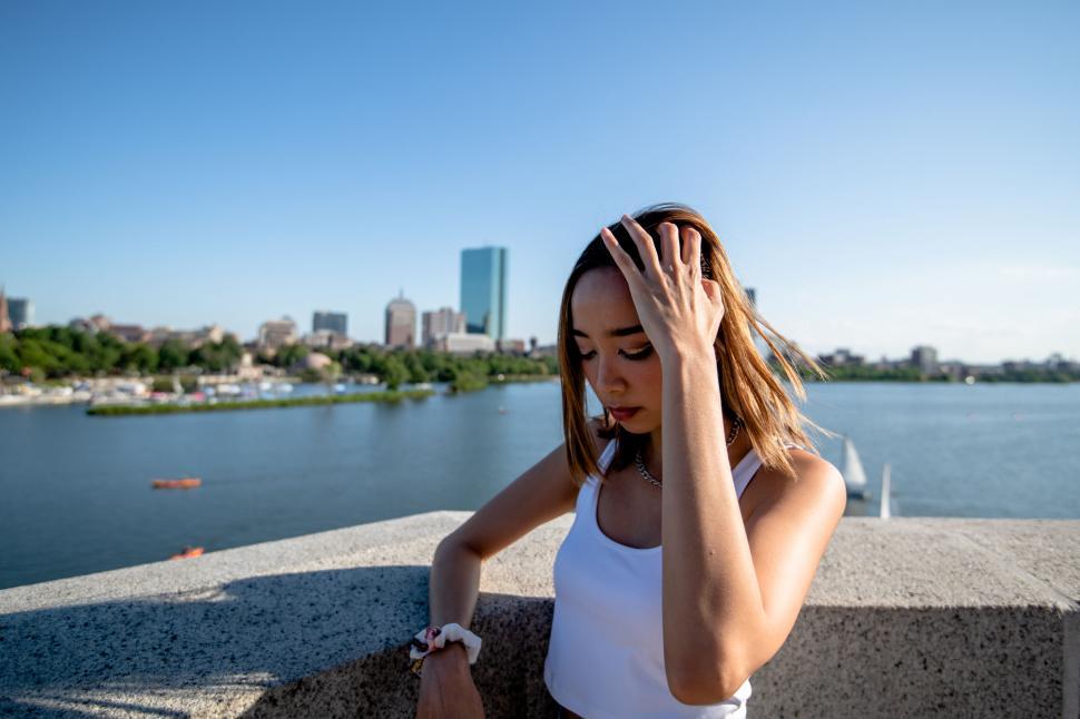 Free Image of Young woman checking the time in urban setting 