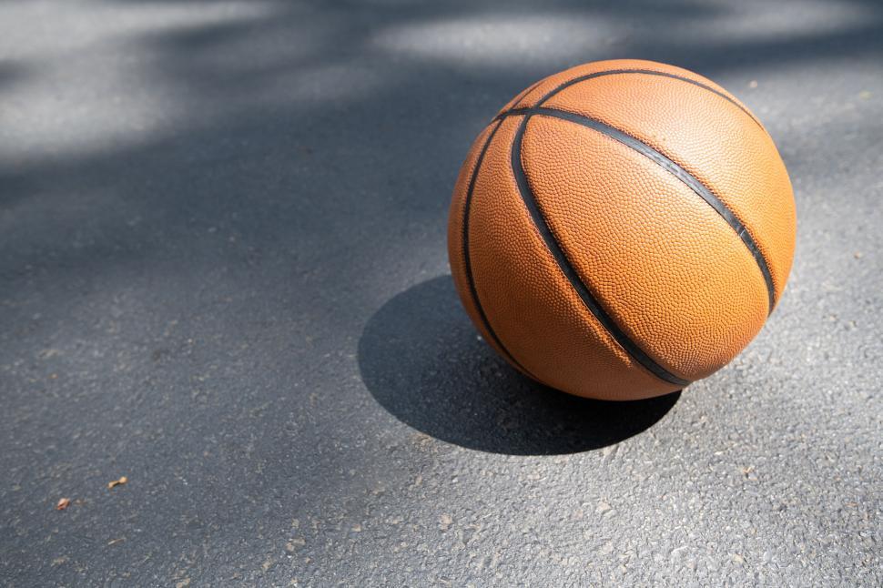 Free Image of Basketball on an outdoor court close-up 
