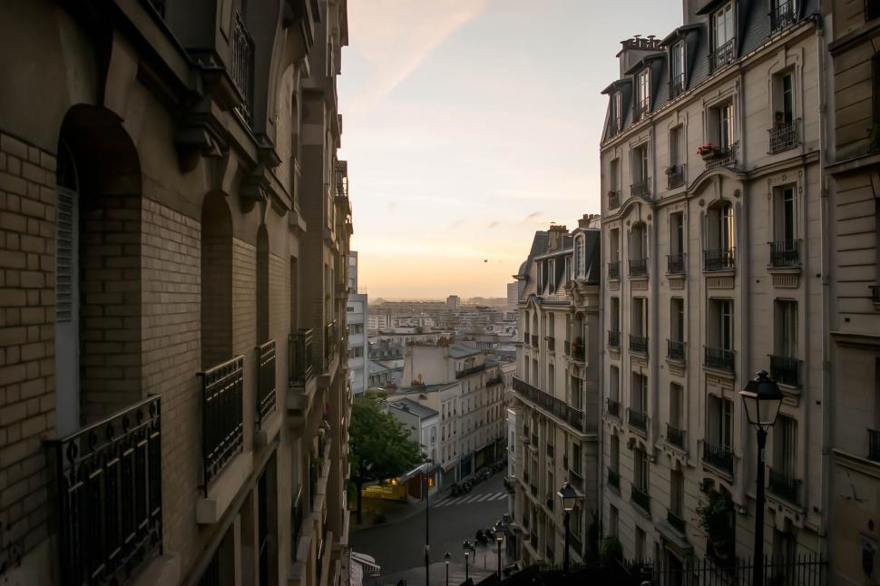 Free Image of Parisian buildings during sunrise with warm tones 
