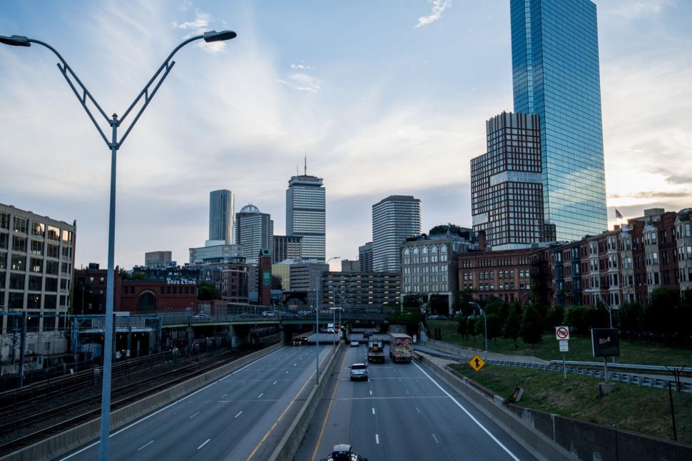 Free Image of City skyline with buildings and highway traffic 