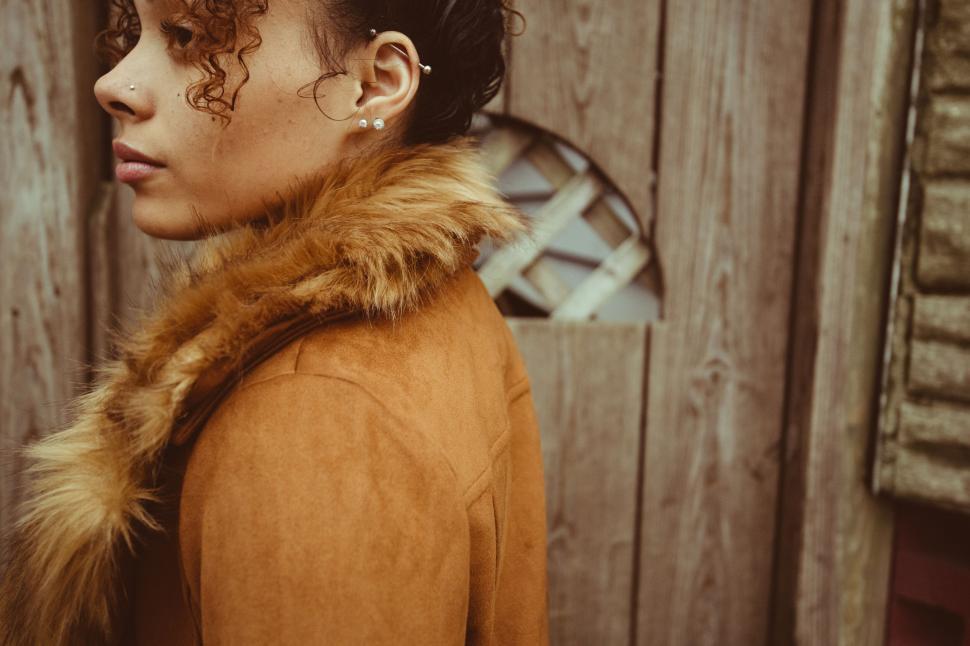Free Image of Artistic portrait of woman in vintage coat 