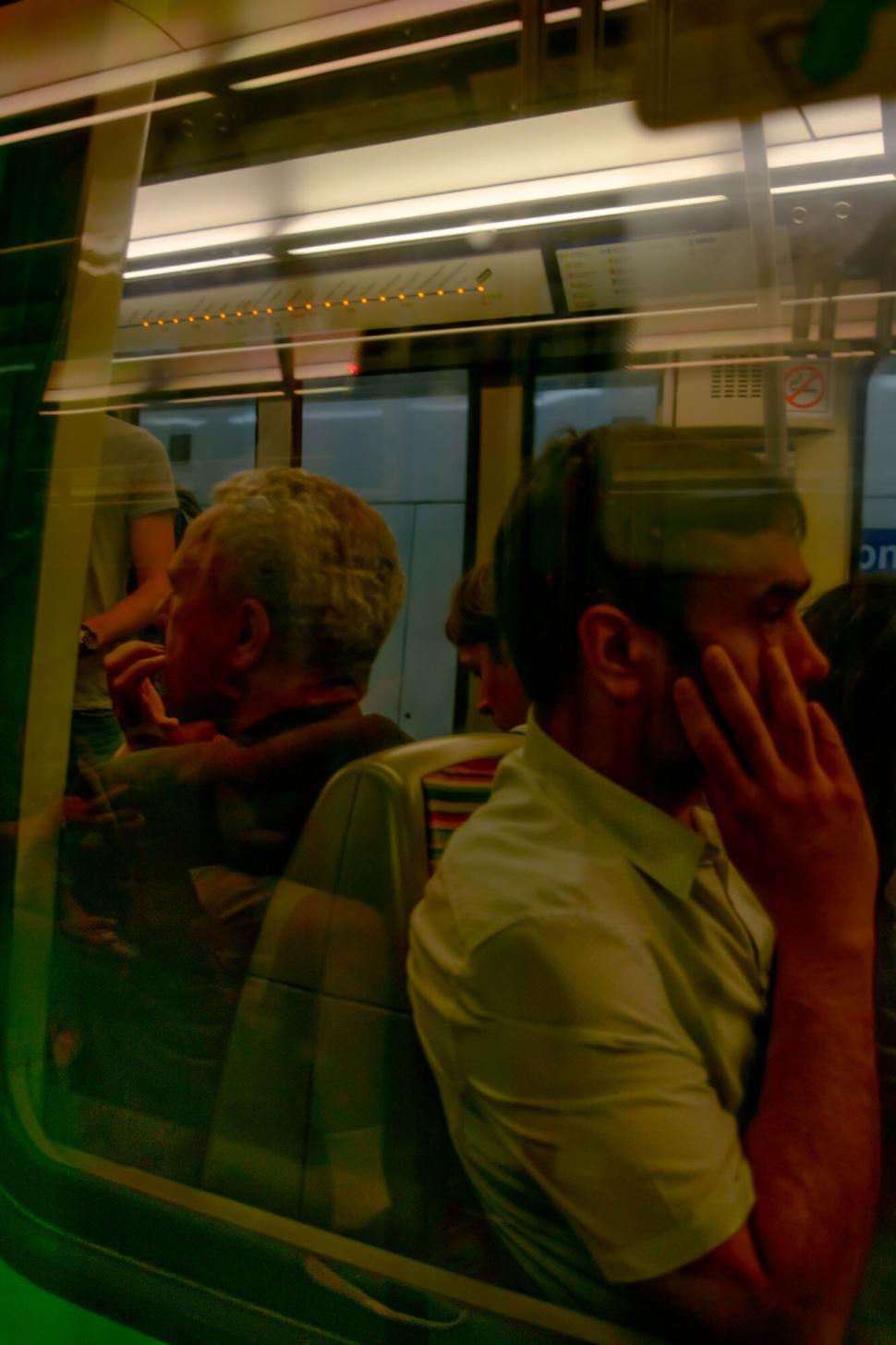 Free Image of Passengers sitting inside a subway train 