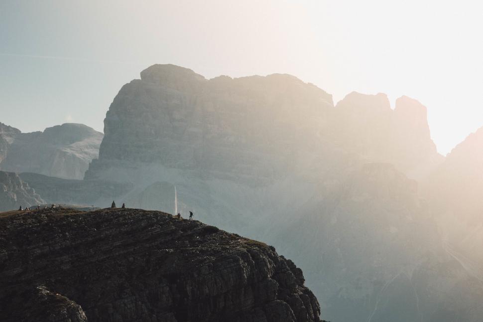 Free Image of Hikers enjoying the sunset on a mountain 