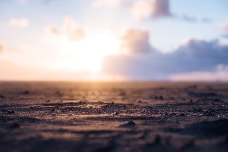 Free Image of Close-up of sandy beach at sunset 