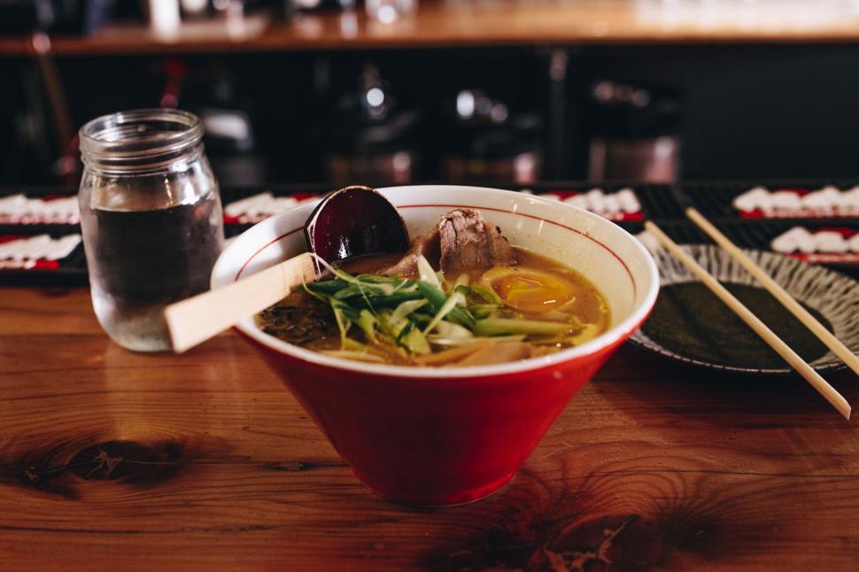 Free Image of Delicious bowl of ramen on wooden table 
