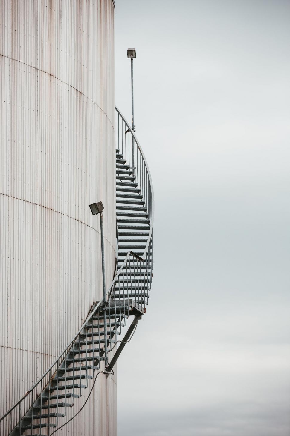 Free Image of Staircase wrapping around an industrial silo 