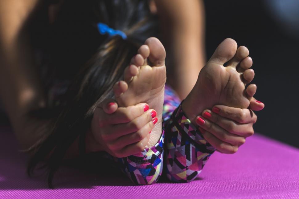 Free Image of Woman practicing yoga, focus on feet 