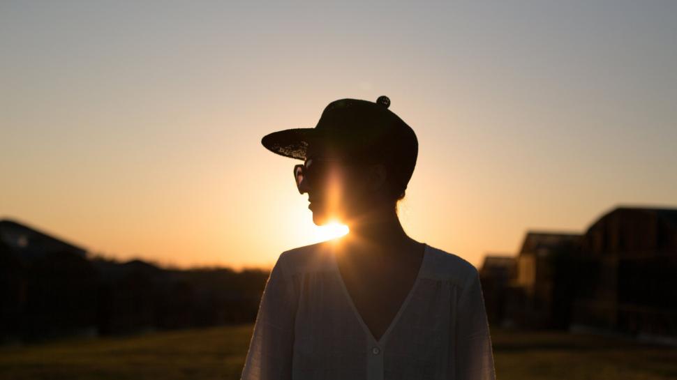 Free Image of Silhouette of woman against the sunset 