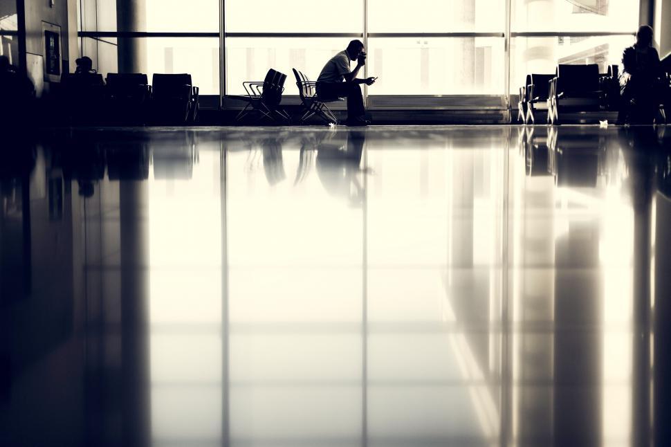 Free Image of Lone person seated in a modern space 