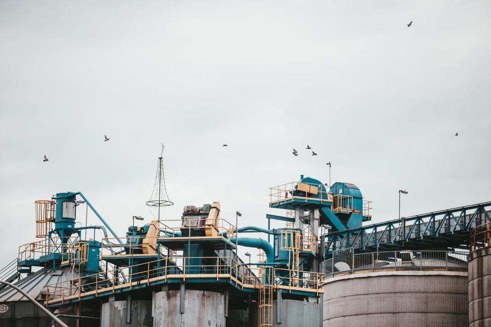 Free Image of Industrial plant with birds flying overhead 