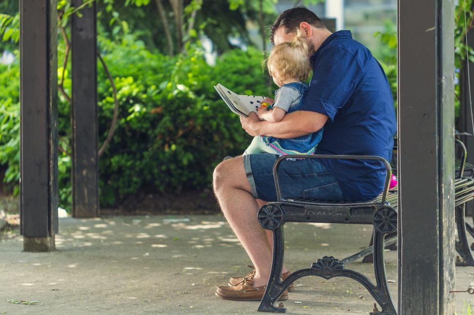 Free Image of Father and child reading a book 