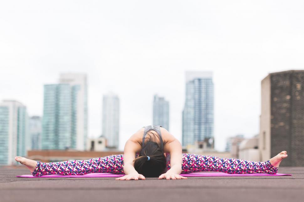 Free Image of Woman practicing yoga in urban setting 