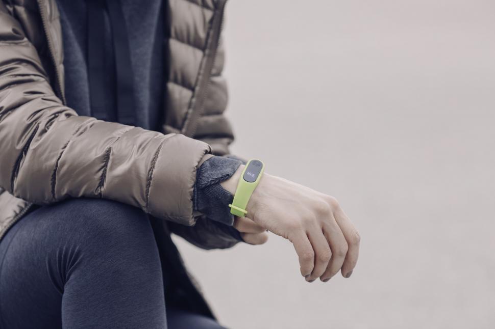 Free Image of Person checking fitness tracker outdoors 